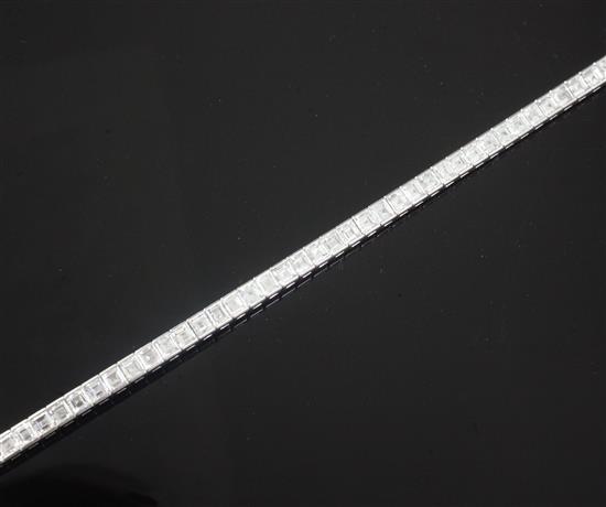 A platinum, iridium and diamond line bracelet, 17.8cm.